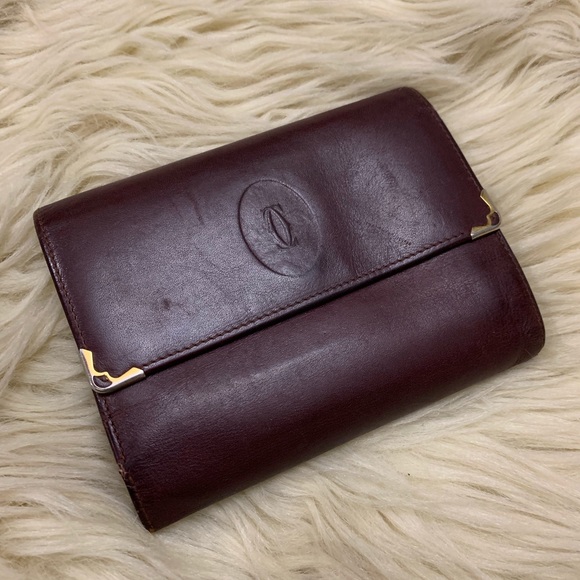 Cartier Handbags - Vintage Cartier Trifold burgundy wallet
